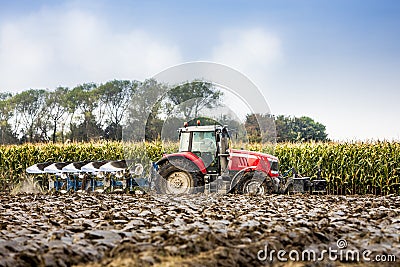 Tractor and plow Stock Photo