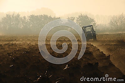 Tractor plowing Stock Photo