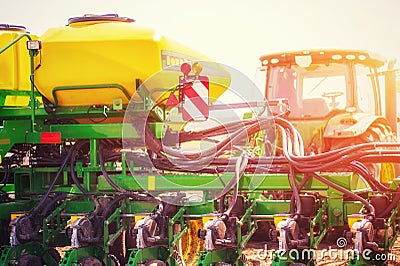 Tractor plowing farm field in preparation for spring planting Stock Photo