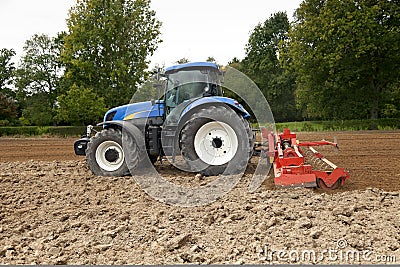 Tractor With Power Harrow Side View Stock Photo