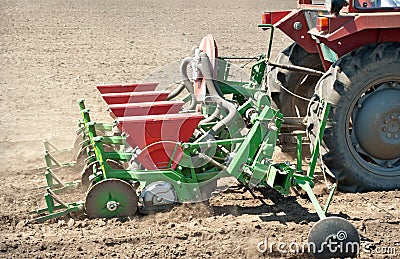 Tractor and seeder Stock Photo