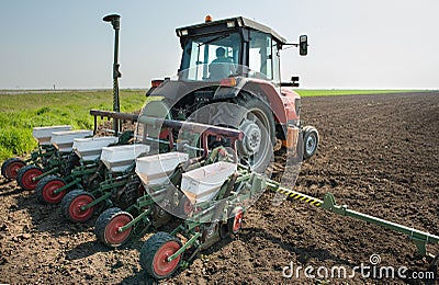 Tractor and seeder Stock Photo