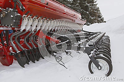 Tractor seeder at winter snow outdoor Stock Photo