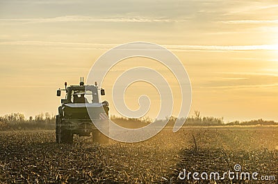 Tractor spreading artificial fertilizers Editorial Stock Photo