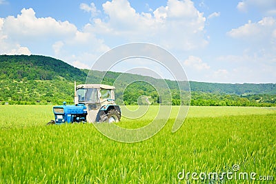 Tractor Standing In A Field Stock Photo