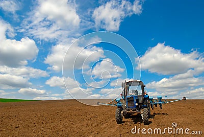 Tractor in tilth Stock Photo