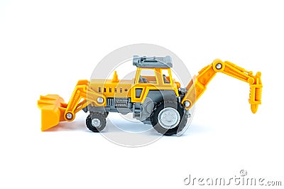 Tractor toy in yellow color isolated on white Stock Photo