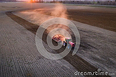 Tractor working field Stock Photo