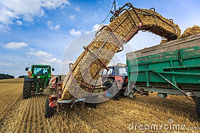 Tractors working on a farm field Editorial Stock Photo