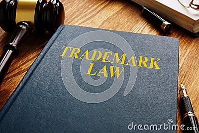 Trademark law and gavel on wooden surface. Copyright concept Stock Photo