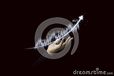 Trader holding graph chart with arrow for analysis stock market information , Investment concept Stock Photo