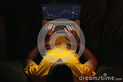 Trader investor using stockmarket app on laptop Stock Photo