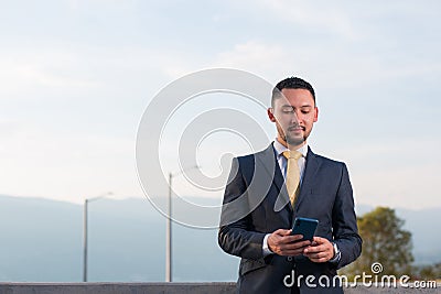 Trader making operations in the exchange platforms from his mobile device Stock Photo