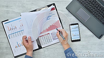 Trader man counting analyzing financial report Stock Photo