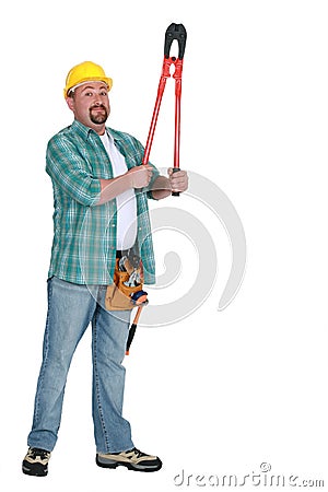 Tradesman holding up clippers Stock Photo