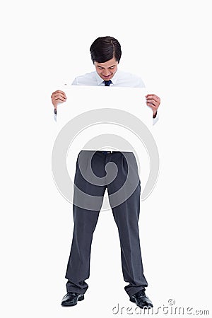 Tradesman looking at blank sign in his hands Stock Photo