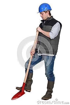 Tradesman using a spade Stock Photo