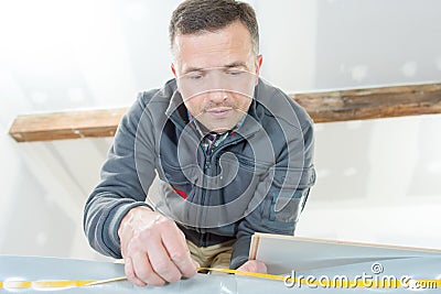 tradesman working on indoor renovation project Stock Photo