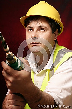 Tradesmen with a drill Stock Photo