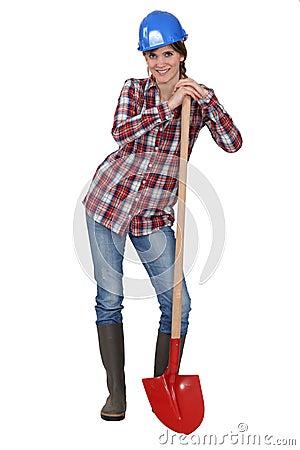 Tradeswoman with a spade Stock Photo