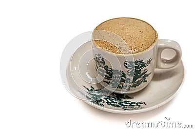 Tradiitional aromatic coffee served in vintage kopitiam cup and saucer in white background Stock Photo