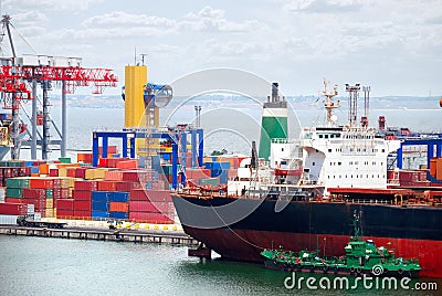 The trading seaport with cranes, cargoes and ship Stock Photo