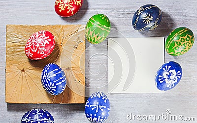 Tradition hand made easter egg with leaf pad and blank paper fot text Stock Photo