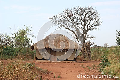 Traditional African authentic huts and straw fences on the border of Zambia and Namibia Editorial Stock Photo