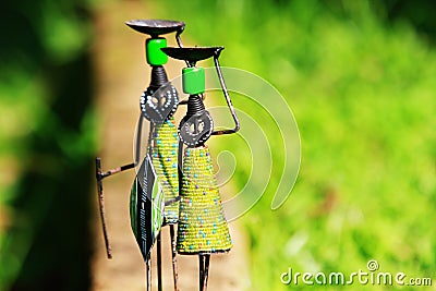 Traditional african craft stick figures with spears Stock Photo
