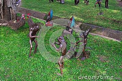Traditional african handcrafted wooden statues of frogs in the garden of Cultural Heritage store in Arusha, Tanzania Editorial Stock Photo