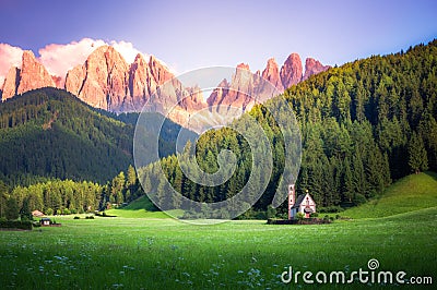 Traditional alpine St Johann church in Val di Funes valley, Santa Maddalena touristic village, Dolomites, Italy. Stock Photo