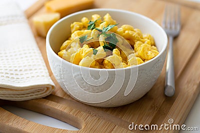 Traditional American macaroni and cheese comfort food also called mac n cheese with elbow pasta coated in a cheesy creamy cheddar Stock Photo