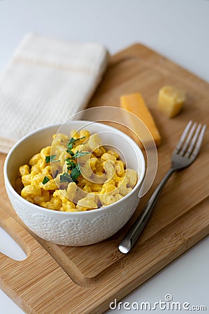 Traditional American macaroni and cheese comfort food also called mac n cheese with elbow pasta coated in a cheesy creamy cheddar Stock Photo