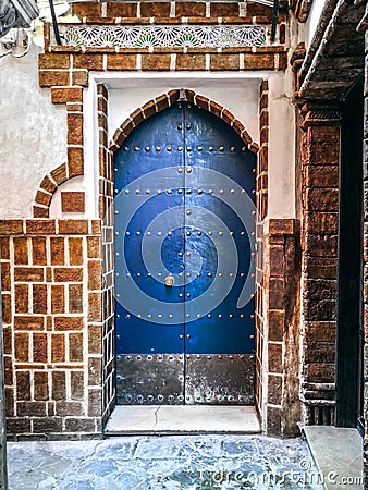 Traditional Andalusian blue entry door. Al-Andalus. Art of Islamic Spain. Seville. Stock Photo