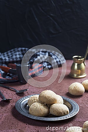 A traditional arabic Egyptian muslim cookie home made shot on a red table with black background Stock Photo