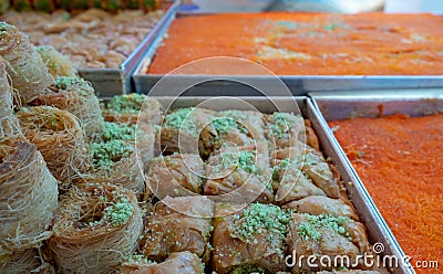 Traditional arabic and turkish sweets pastry dessert kadaif kunafa, baklava, with pistachio Stock Photo