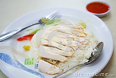 Traditional Asian Chinese Street Food: Khao Man Kai Kao Man Gai is Hainanese chicken rice, steamed chicken meat and white rice. Stock Photo