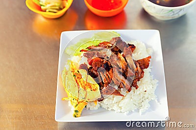 Traditional asian food. Fresh scrambled eggs with rice and barbecued meat Stock Photo