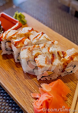 Traditional Asian food sushi on wooden plate. Stock Photo