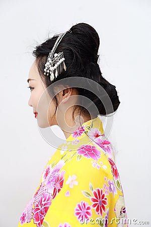 Traditional Asian Japanese woman with kimono with a fan on hand on isolated white background Stock Photo