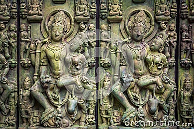 Traditional Asian stone carving of Buddhism deities illustrating Asian culture and Asian carving craft Stock Photo