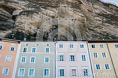 Traditional Austrian multicolored houses in the rock in Salzburg. Austrian architecture of building houses. Salzburg Stock Photo