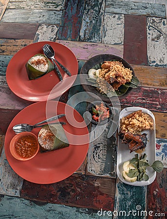 Traditional Balinese food on a stylish colourful table in Nusa Dua at Bali in Stock Photo