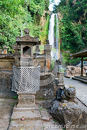 Traditional Balinese house of spirits near waterfall Stock Photo