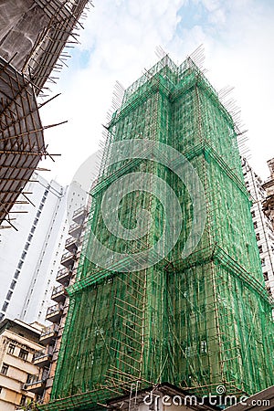 Traditional Bamboo Scaffolding in Building Construction Stock Photo