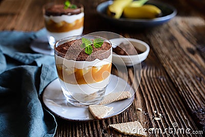 Traditional Banoffee dessert with caramel, banana, biscuit cumbs and whipped cream Stock Photo