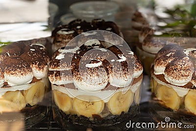 Traditional Banoffee dessert with caramel, banana, and whipped cream sale in cafe. Stock Photo