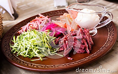 Traditional Belarusian salad of vegetables and bacon. salad Paparats kvetka Stock Photo