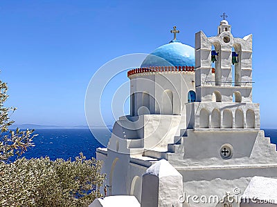 Traditional bells tower and blue dome of the orthodox white churches, Sifnos island, Greece Stock Photo