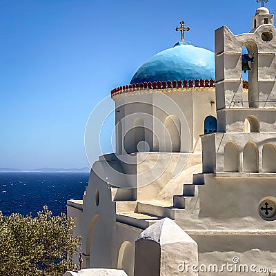Traditional bells tower and blue dome of the orthodox white churches, Sifnos island, Greece Stock Photo